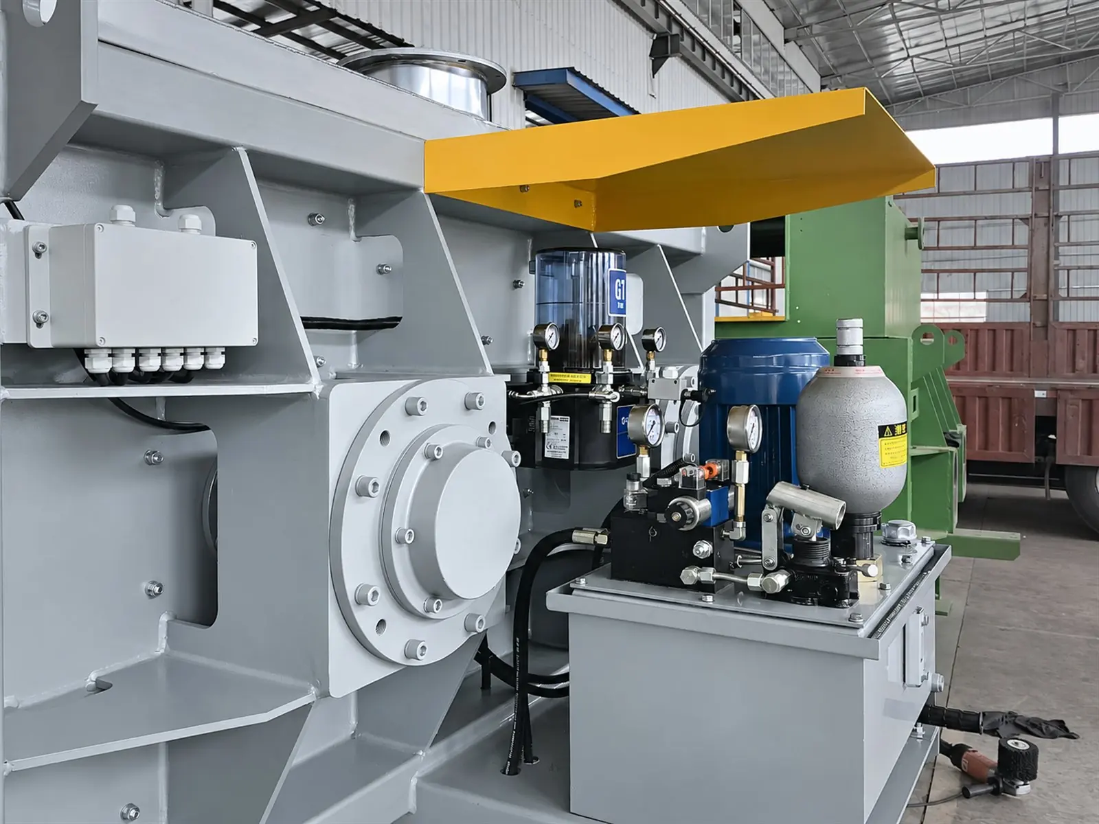 Drive end of a twin-shaft mixer with its hydraulic power pack, in our workshop