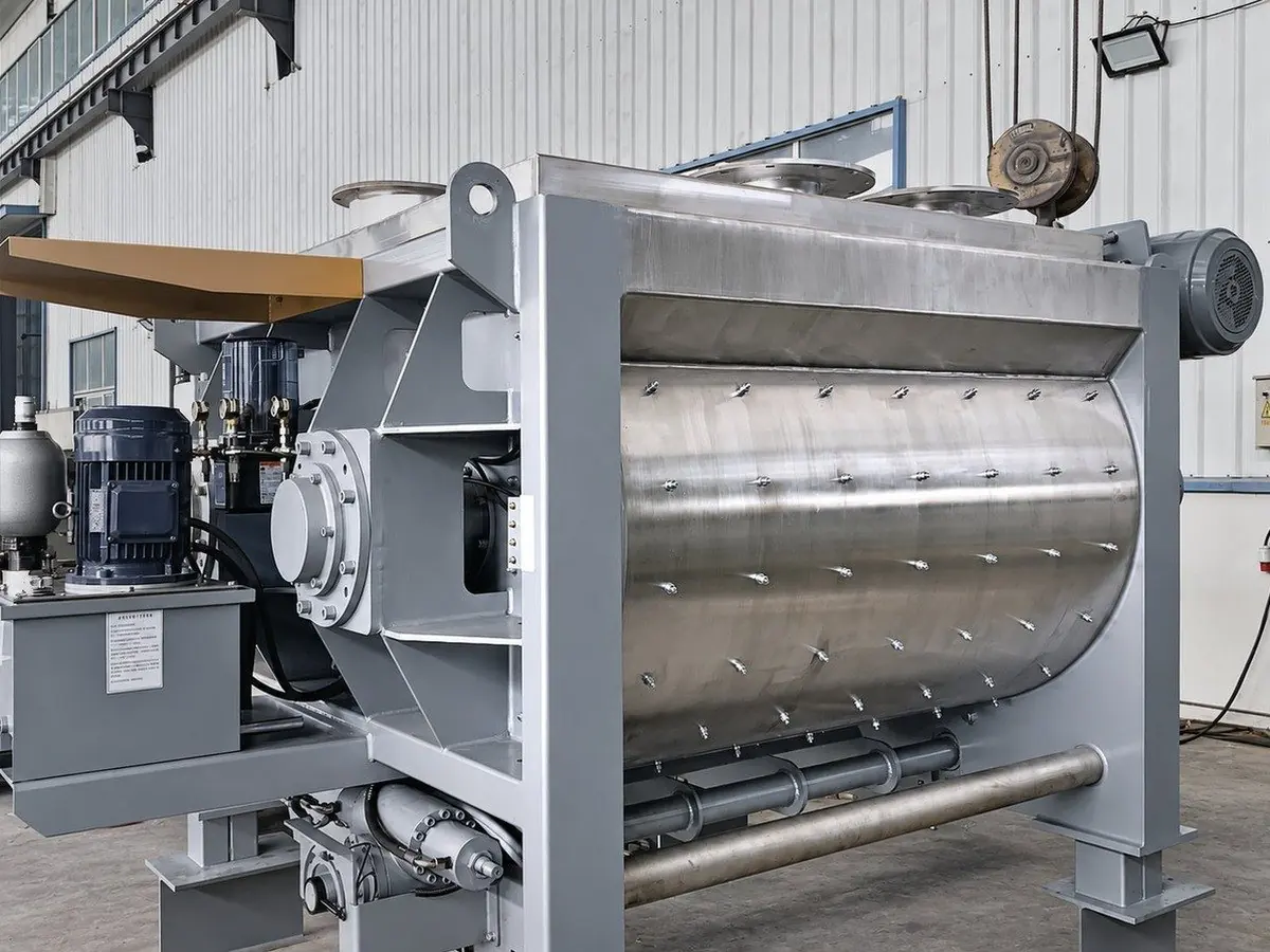 Twin-shaft mixer with hydraulic discharge, finished in our workshop