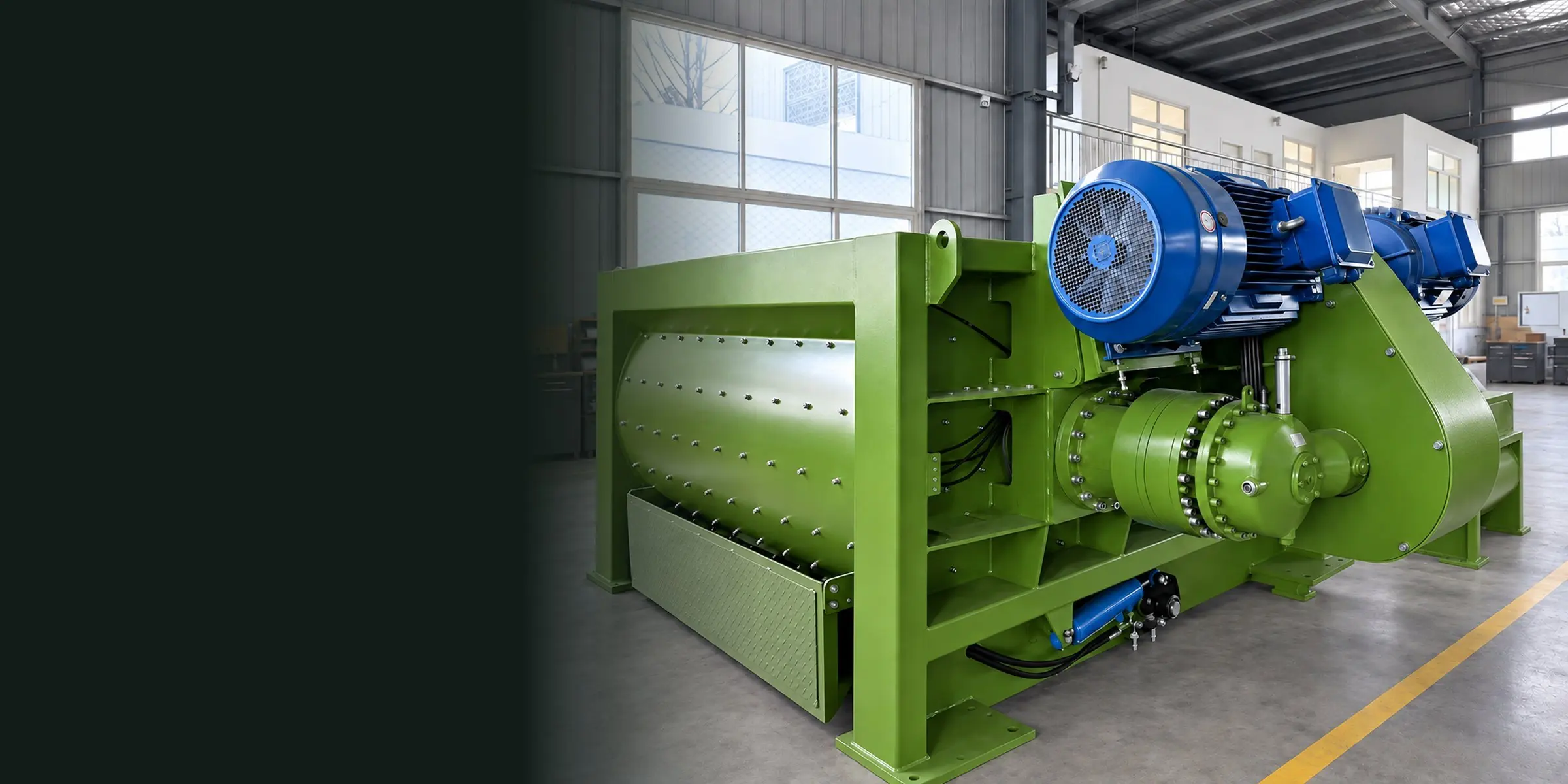 Green twin-shaft mixer with blue motors, belt guard and reducer, finished in our workshop