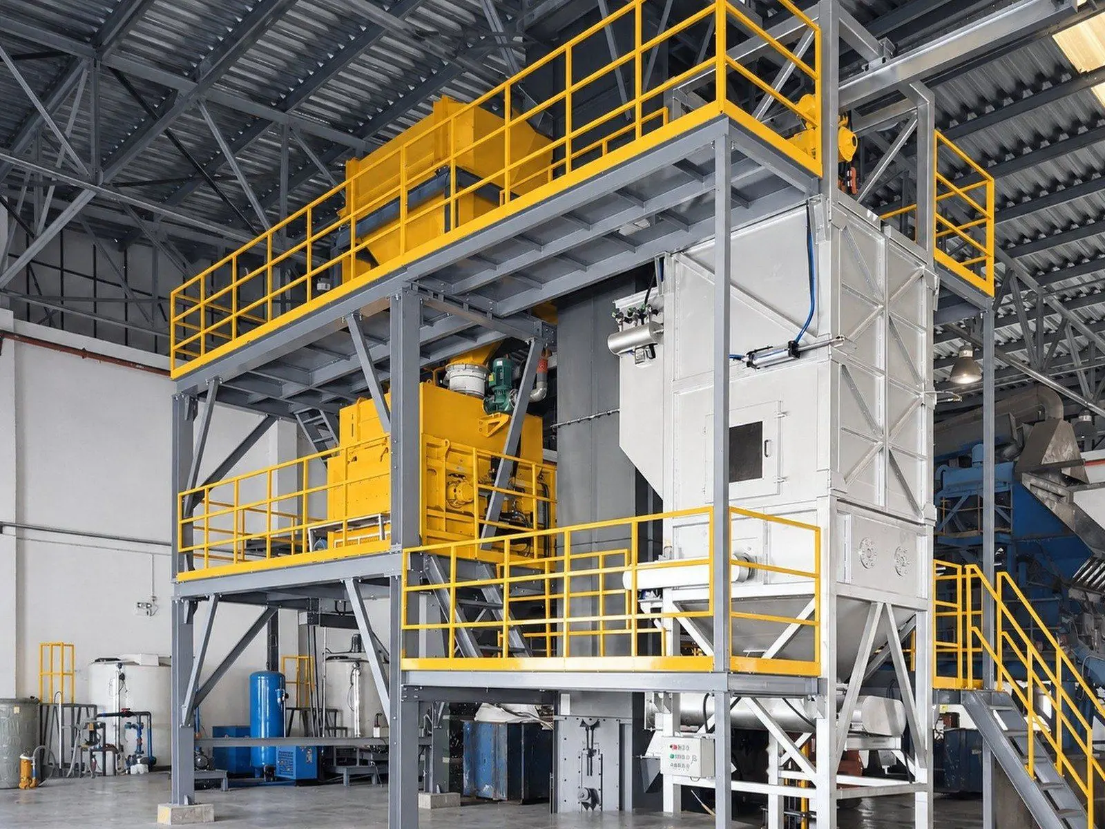 Stabilization section with a twin-shaft mixer on a steel platform at a hazardous-waste treatment centre in Guangzhou